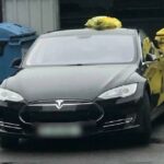 Тесла мешала мусоровозу