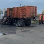 Зажат мусоровозм